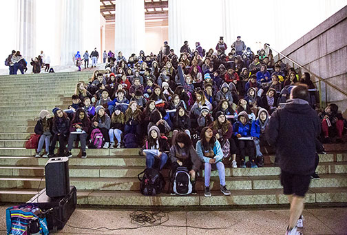 Sojourners gather around Jeff at the Lincoln Memorial.
